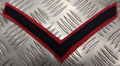 Genuine British Army Lance Corporal Rank Chevron Long Navy Blue on Red NEW
