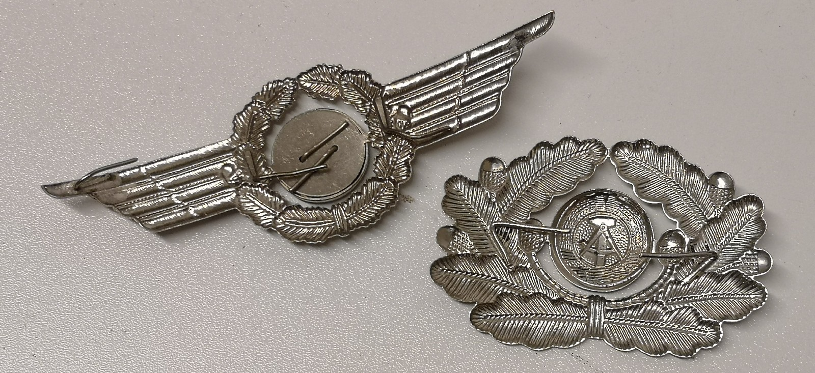 Genuine East German Forces Metal Cap Badges DDR NVA set of 2