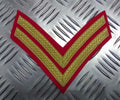 Braided Corporal Rank Stripes 2 Chevrons Gold on Red British Forces - Used