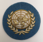 UN Nations Round White and Gold on Light Blue Wire Braided Beret Badge