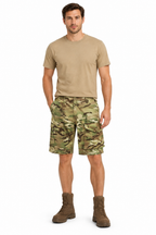 Camouflage shorts styled on a model with a tan T-shirt and brown boots