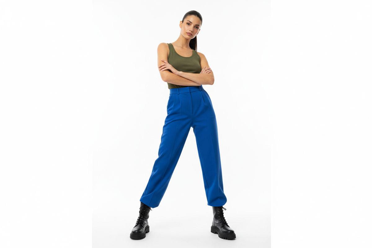 Female Fashion Model - Olive Vest with Bright Trousers and Boots