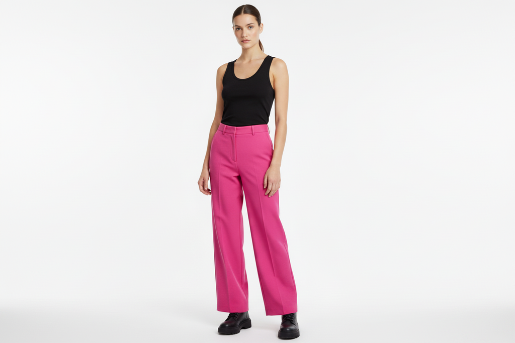 Female model pink trousers - black vest