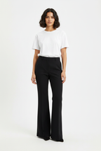 Female model wearing bell bottom trousers from reference