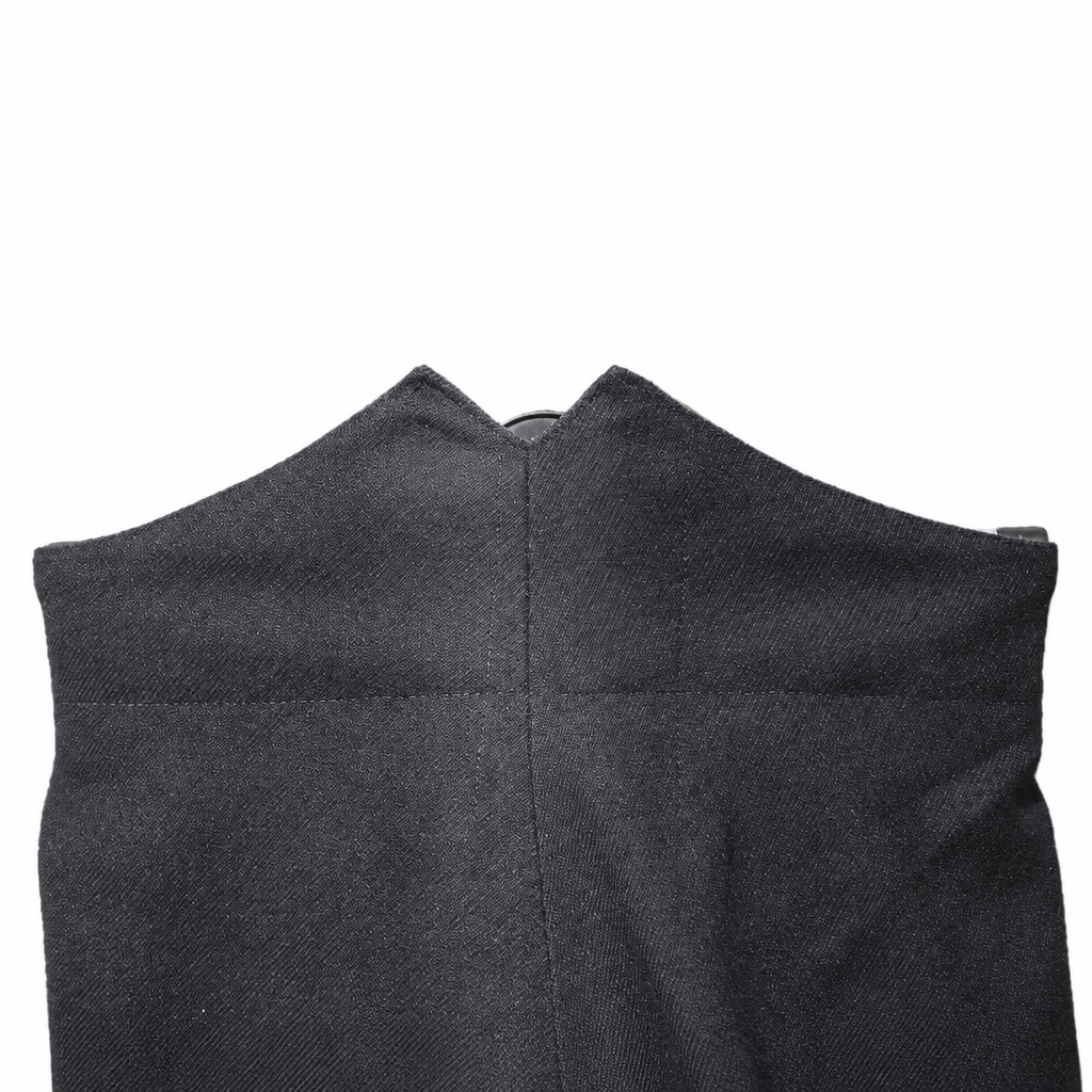 Black wool dress trousers with red piping on a white background