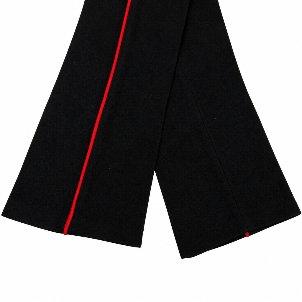 Black wool dress trousers with red piping on a white background