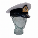 Royal Navy officer cap with gold badge on glass mannequin white background