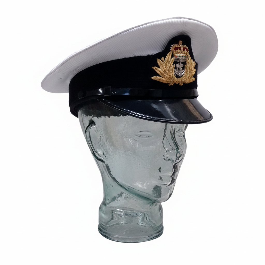 Royal Navy officer cap with gold badge on glass mannequin white background