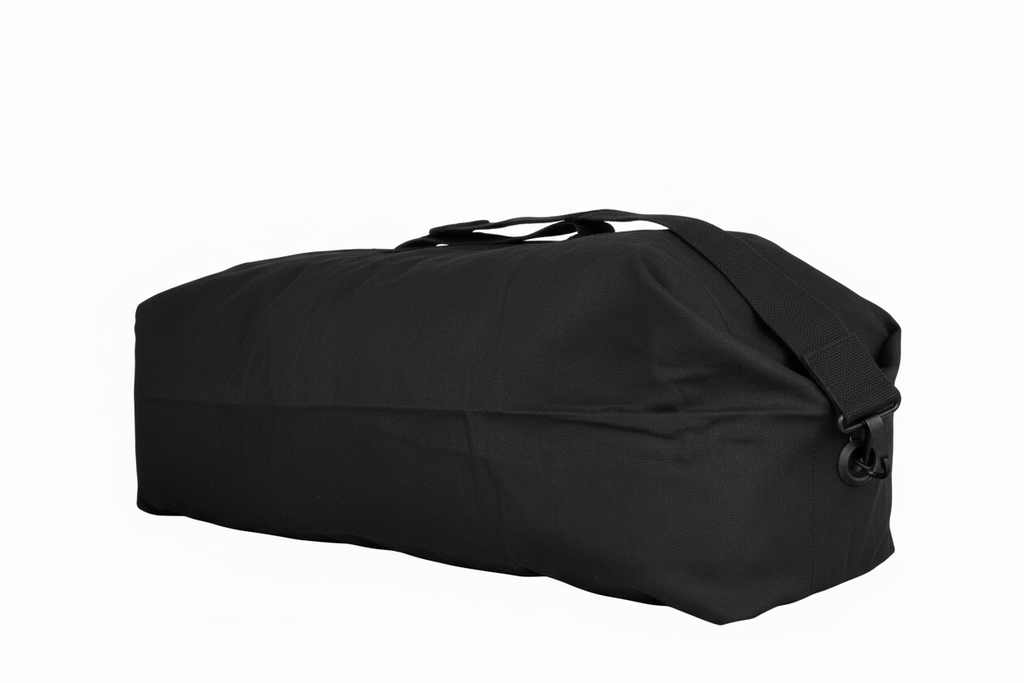 Black military kit bag laid flat on a white background