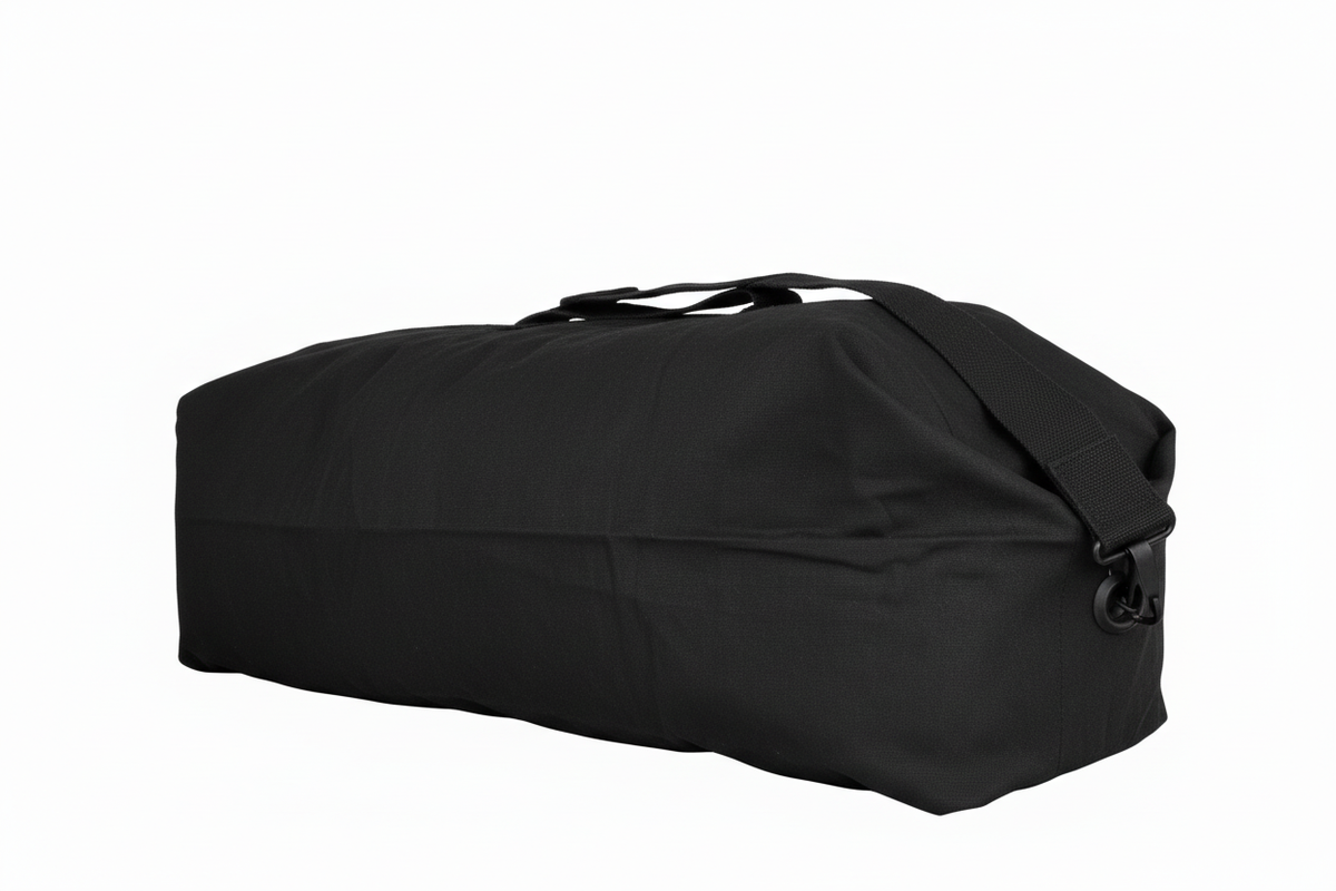 Black military kit bag laid flat on a white background