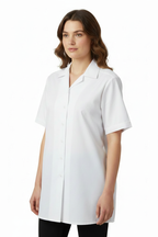 Female model wearing white short-sleeve shirt with shoulder epaulettes