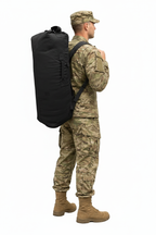 Male soldier with black kit bag