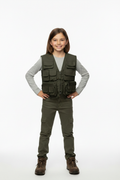 Young girl in adventurer stance wearing olive green combat vest